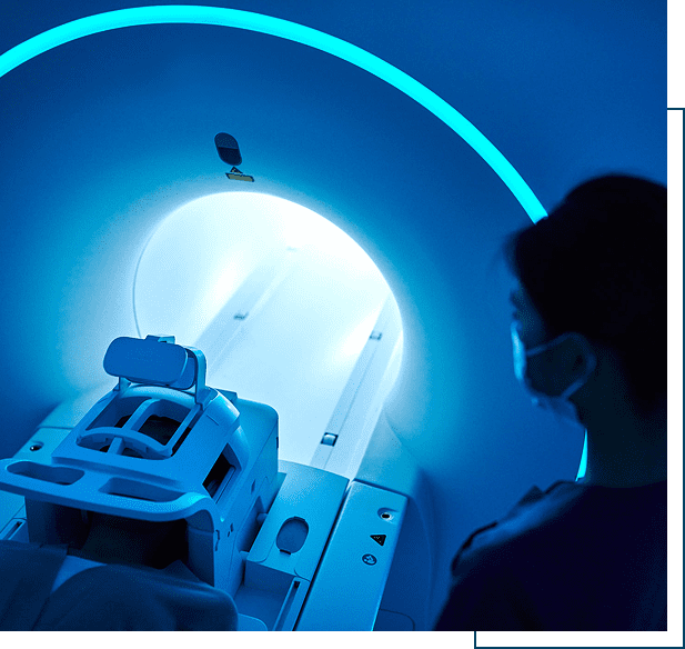 MRI machine with medical staff nearby.
